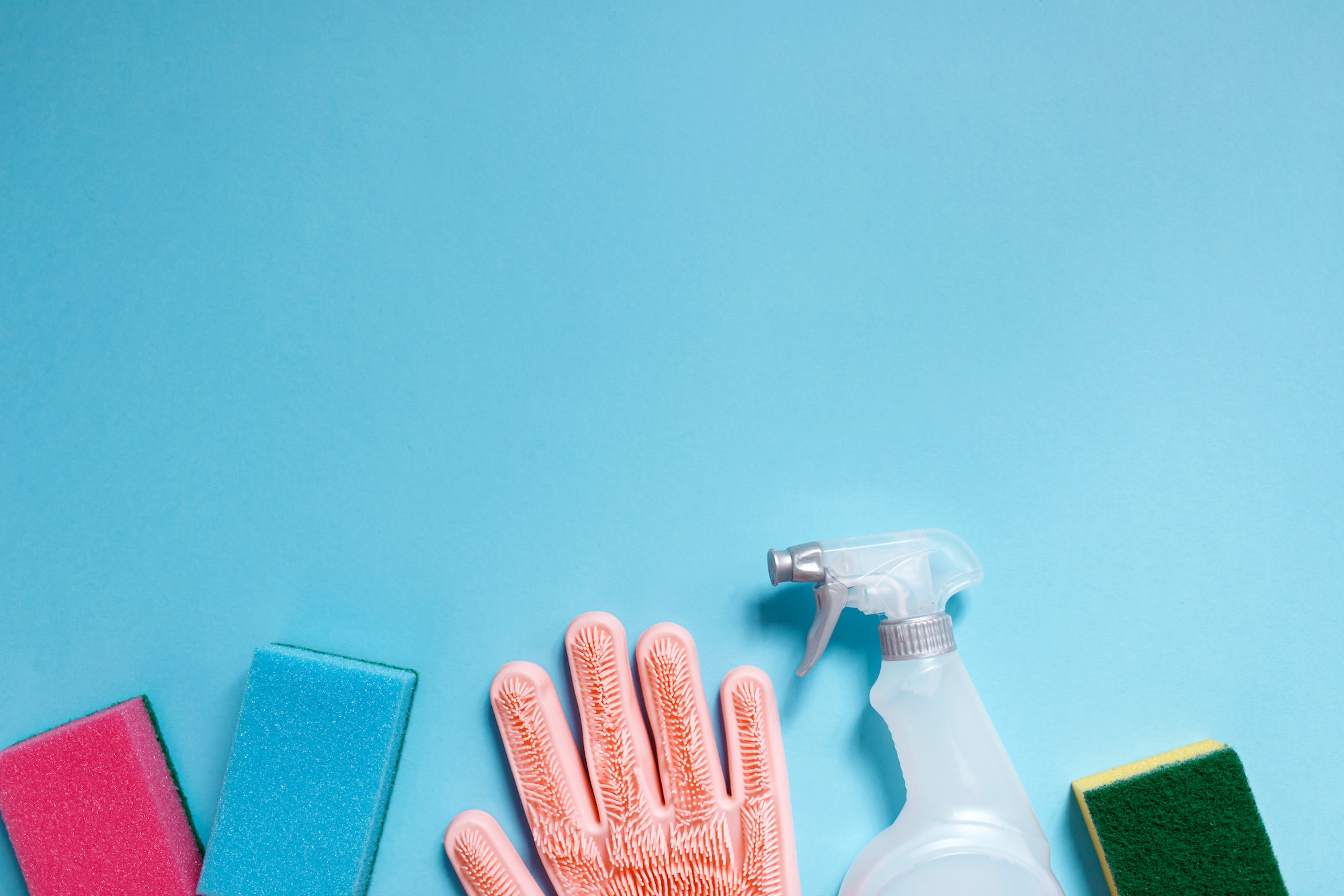 Cleaning supplies collection on blue background. Housework concept. Cleaning tools.