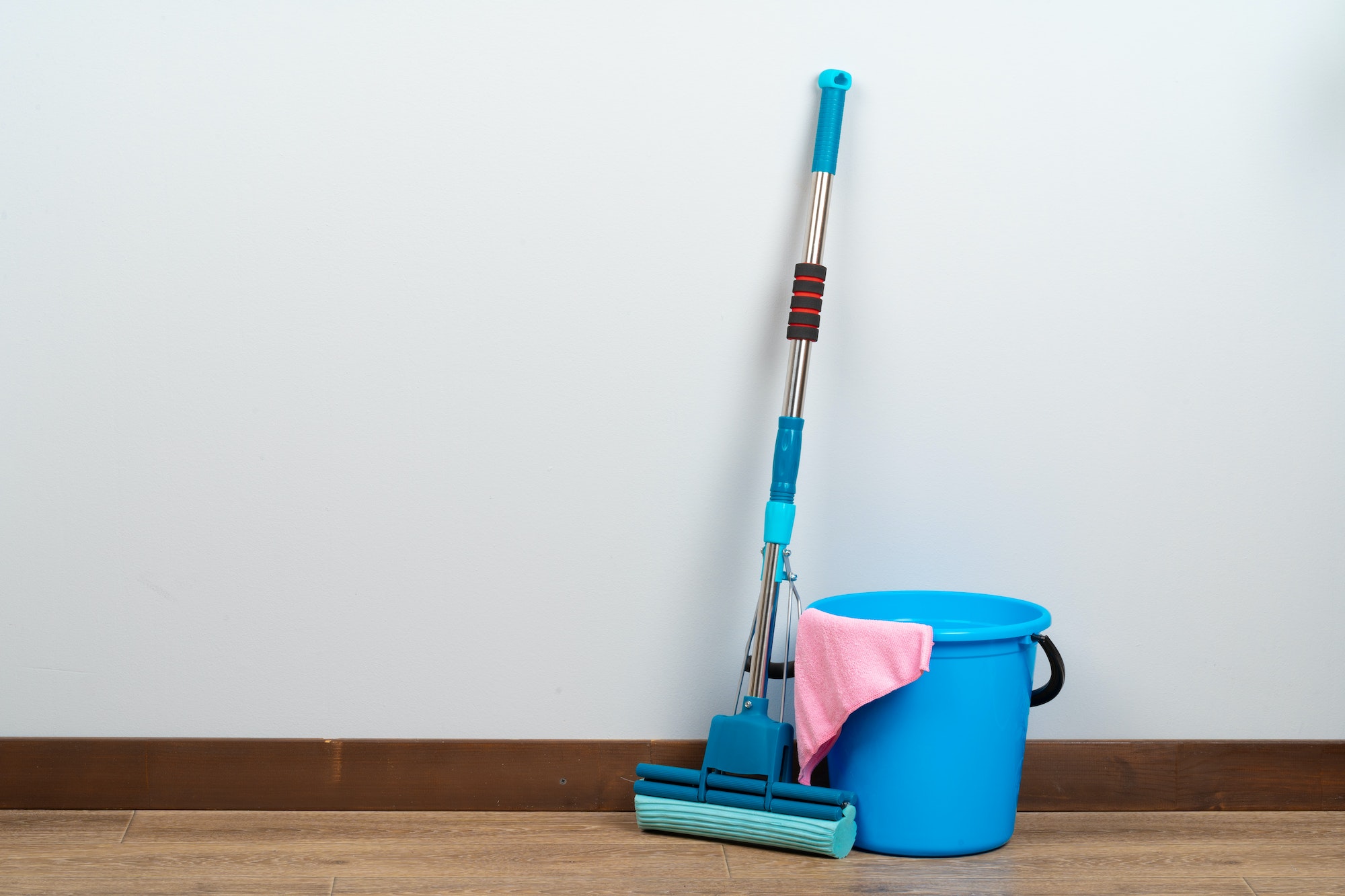 Cleaning tools for house cleaning on wooden floor